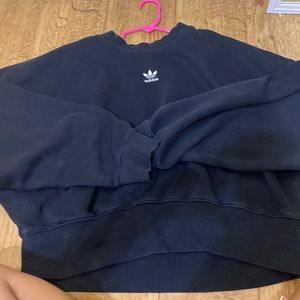 i am selling a cropped adidas black sweatshirt.